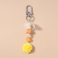 Detail of yellow rose pendant keychain with striped square beads and silver spring clasp - Yellow Rose Beaded Style / Yellow Flower