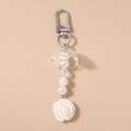 Detailed close-up of a white rose bead pendant keychain with elegant acrylic pearls - White Rose Beaded Style / White Flower