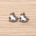 Macro detail of dark metal unicorn rocking horse pendants with iridescent resin inlay - Gun Black Frame with Iridescent White (3059) / 5 Pieces / Off-White