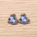 Macro shot of unicorn charms with blue iridescent fill and gunmetal finish for DIY jewelry - Gun Black Frame with Iridescent Blue (3059) / 5 Pieces / Black and Blue