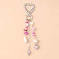 Detail of pink and white heart keychain with pearls, turquoise beads and rhinestones - Pink