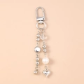 Detail of silver beaded keychain with metal heart pendant and white pearl charm - Beaded Heart