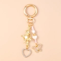 Detail of gold butterfly keychain with pink beads, enamel wings and crystal heart charm - Butterfly Heart