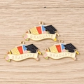 Detail of three alloy enamel graduate charms featuring graduation cap and books pendants - Graduation Cap