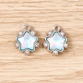 Macro detail of two star pendants with aurora crystals and silver metal plating for DIY jewelry - 5 Pieces / Silver Blue