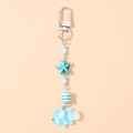 Close-up of ocean-themed starfish and fish keychain with blue beads and silver clasp - Blue Goldfish