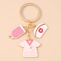 Detail of nurse theme keychain with pink IV bag, medical cap and uniform enamel charms - Pink Nurse Uniform Hat