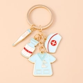 Detail of medical keychain with nurse hat, thermometer, blue pill bottle and scrub top - Blue Nurse Uniform Medicine