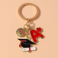 Detailansicht Schlüsselanhänger Abschluss mit Lucky-Anhänger, A+ Symbol und Doktorhut-Motiv - Absolventenhut