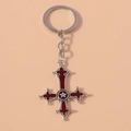 Détail du porte-clés croix gothique argentée avec émail rouge et étoile centrale - Rouge