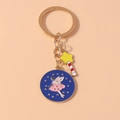 Detail of fairy wand keychain with star pendant and blue enamel fairy disc charm - Fairy