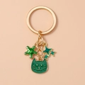 Golden cat keychain with green starfish and celestial pendants for handbag decoration - Cat Star Style