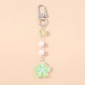 Detail of green cherry blossom pendant with white pearls and silver snap hook - Green