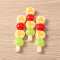 Macro detail of glossy resin food charms featuring colorful dango balls and floral patterns - Roasted Banana / Set of 4
