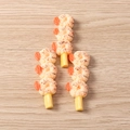 Macro shot of resin food charms featuring detailed fried shrimp skewers on wood - Roasted Shrimp Tail / Set of 4
