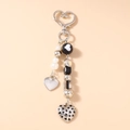 Detail of beaded keychain with silver heart clasp and LOVE YOU engraved heart pendant - Silver