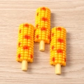 Detailed close-up of realistic resin grilled corn food models on a light wooden surface - Grilled Corn / Set of 4