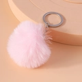 Close-up of soft pink 8cm faux fur pom-pom keychain with silver metal ring - Pink