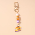 Detail of Halloween eye cake keychain with colorful enamel charm and beaded strap - Eye Cake Purple Beads