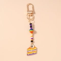 Detailed view of Halloween eyeball cake keychain with colorful beads and gold lobster clasp - Eye Cake Colorful Beads