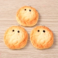 Close-up of three miniature resin bread charms with cute faces on light wood background - Cute Smile Bread / Set of 4