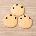 Detail of three resin chocolate chip cookie pendants with silver metal loops on wood - Chocolate Chip Cookie / Set of 4