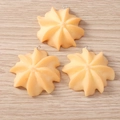 Close-up of three star-shaped cookie charms with silver metal rings for DIY jewelry - Star Spritz Cookie / Set of 4