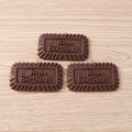 Macro detail of chocolate-themed resin pendants with Happy Birthday embossed design - Happy Birthday Chocolate Cookie / Set of 4