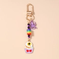 Detail of Halloween keychain with purple spider bead and eyeball cupcake charm - Purple Halloween Cupcake Eye Spider
