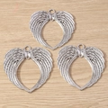 Detail of silver-plated angel wing charms with heart hollow-out design for DIY jewelry - Antique Silver
