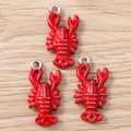 Detailed view of three red enamel lobster charms with silver rings for DIY jewelry making - Silver