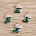 Macro detail of four Christmas stocking pendants with green enamel and gold star patterns - 10 Pieces Pack / Green Christmas Sock