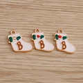 Close-up of white enamel Christmas stocking charms with letter B and red berry detail - 10 Pieces Pack / White Christmas Sock with B