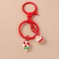 Detail of Christmas keychain with Santa Claus charm and festive candy cane ornament - Candy Santa Claus