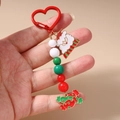Porte-clés de Noël avec mousqueton cœur rouge et breloques de perles Père Noël - Style Père Noël Bonbon