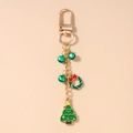 Dettaglio portachiavi natalizio con campanelli verdi e ciondolo albero dorato - Albero di Natale Ghirlanda Campana