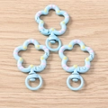 Close-up of sky blue floral lobster clasp with pink and yellow polka dots on wood surface - 5 Pieces / Blue