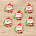 Close-up of Santa Claus and Christmas tree alloy pendants for DIY jewelry making - Santa Holding Tree (2402)