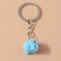 Detailed close-up of light blue resin elephant keychain with silver metallic ring - Lake Blue