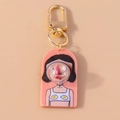 Detail of creative cartoon girl keychain with pink acrylic bubble and gold lobster clasp - Pink