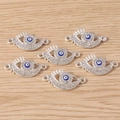 Close-up of evil eye jewelry connectors with rhinestones on a wood background - Rhinestone Eyes / 10 Pieces Pack