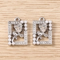 Detailed macro view of silver rhinestone flower charms with pearls for DIY jewelry making - Square Artificial Pearl Tulip - Silver / 5 Pieces