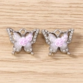 Detailed macro of two butterfly charms with pink roses and sparkly rhinestones for DIY jewelry - Rose Butterfly / 5 Pieces / Silver Purple
