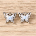 Detail of butterfly pendants with rhinestones, resin wings, and a blue rose accent - Rose Butterfly / 5 Pieces / Silver Blue