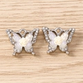 Macro detail of rhinestone butterfly pendant with cream rose and silver hanging loop - Rose Butterfly / 5 Pieces / Silver