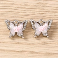 Detailed view of silver rhinestone butterfly charms with pink rose centers and pearl wings - Rose Butterfly / 5 Pieces / Silver Pink