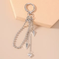 Close-up of silver punk keychain featuring metal beads and heart charms on a stand - Small Heart Beaded Style