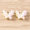 Macro detail of gradient resin butterfly charms with sparkles and gold metal base - Flower Butterfly / 5 Pieces / Gold Purple