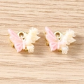 Macro detail of DIY resin butterfly charms with gold metal loops and glitter finish - Flower Butterfly / 5 Pieces / Gold Pink