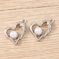Detail of silver hammered metal heart pendants with white pearl inlay and loop - Irregular Heart / 5 Pieces / Silver